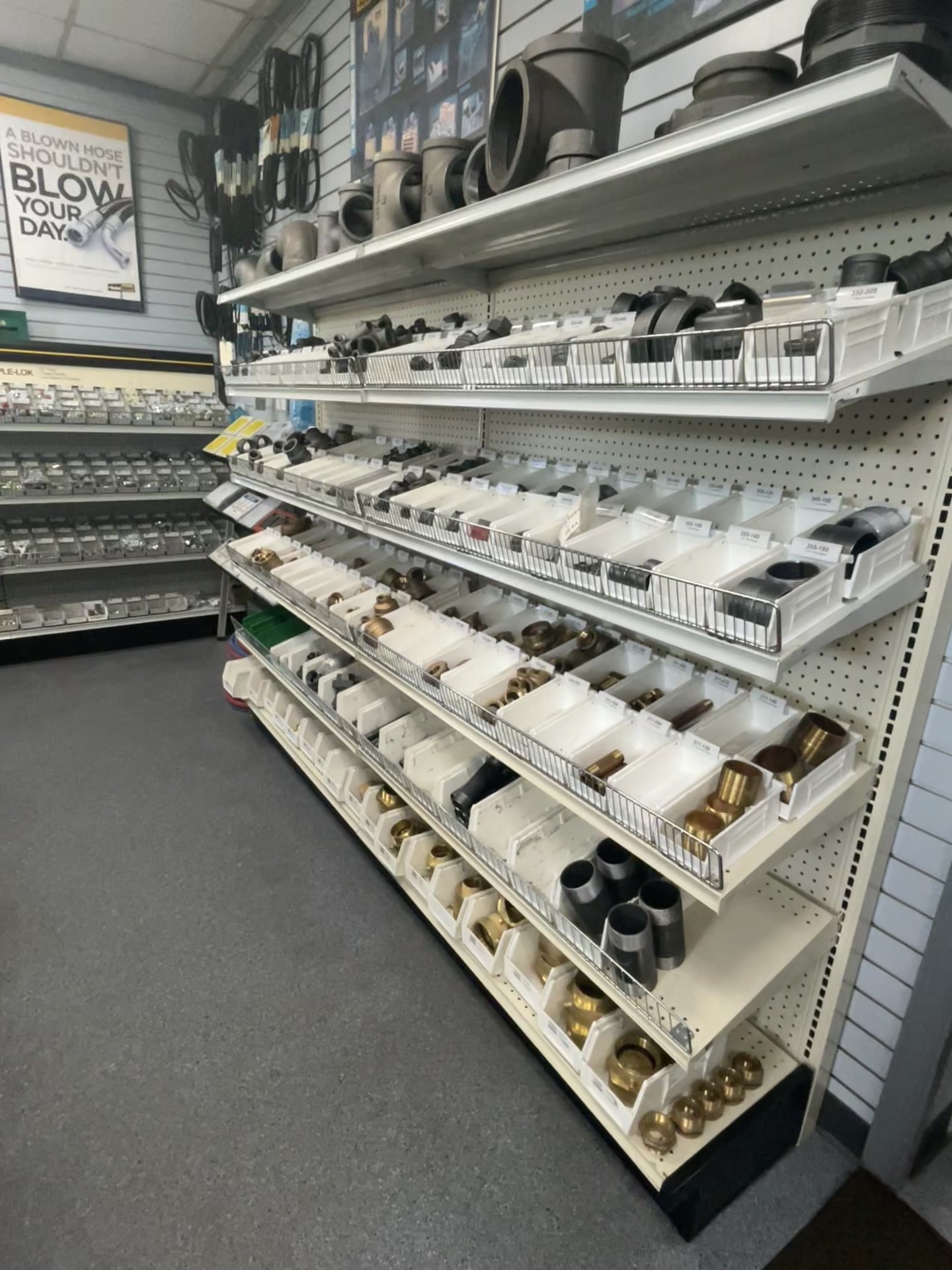 B&B Hose shop shelves stocked with hose fittings, adapters, brass and iron couplings at both Hampton Roads locations