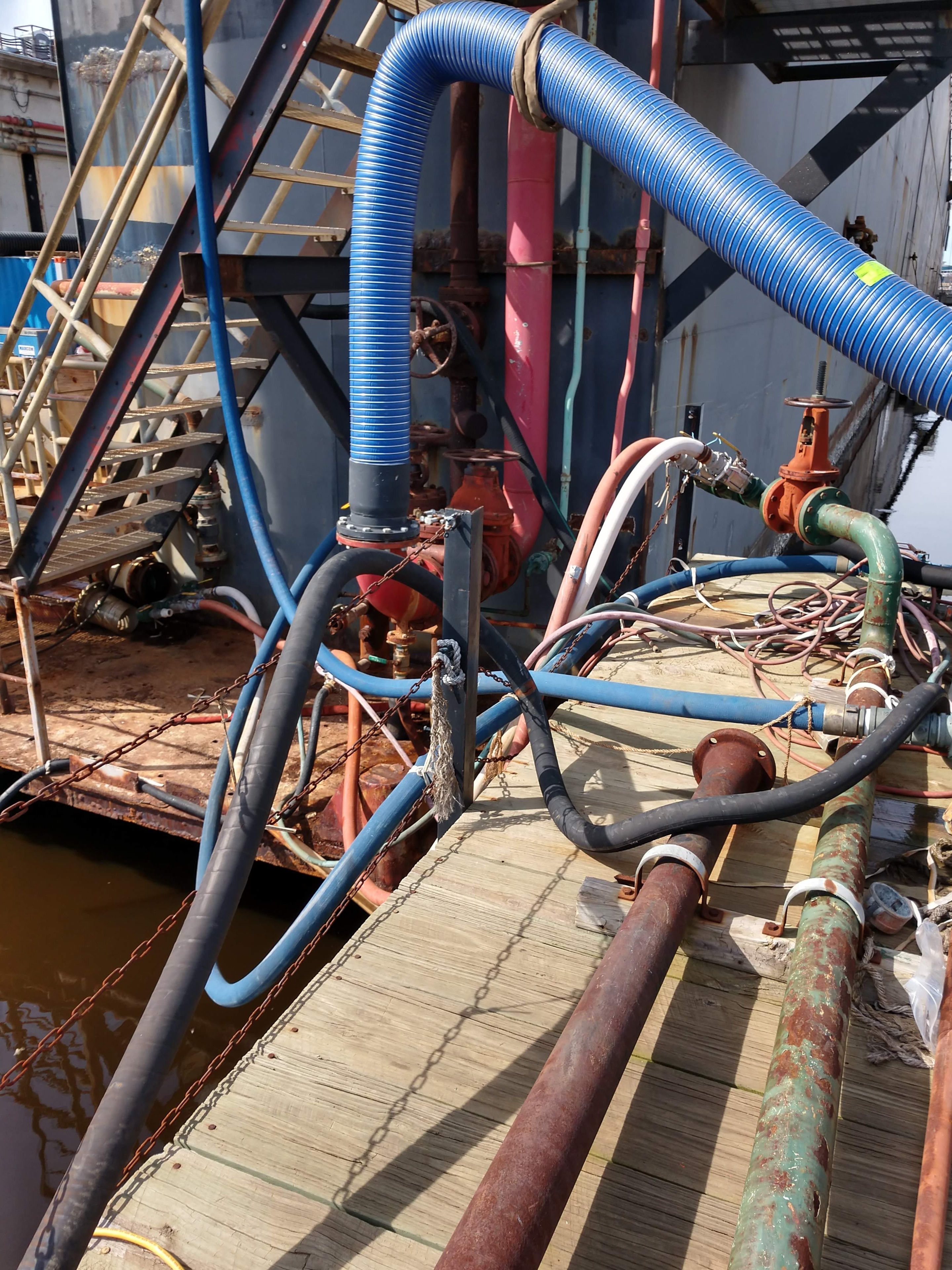 Custom hose and tube assemblies installed on a vessel — shipboard hose routing and connections