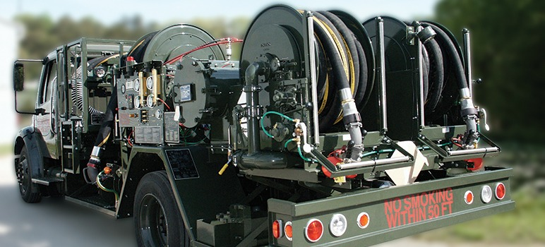 Military fuel truck equipped with multiple mil-spec hose reels for aircraft and vehicle refueling operations — Hampton Roads defense supply